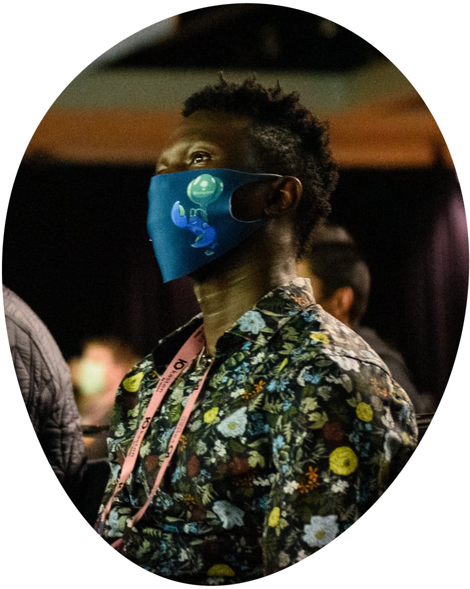 Masked man at a conference